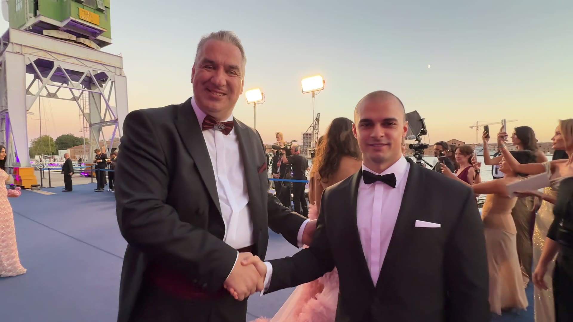 Representatives of G-House Global Affairs at the amfAR gala, San Clemente Palace, Venice